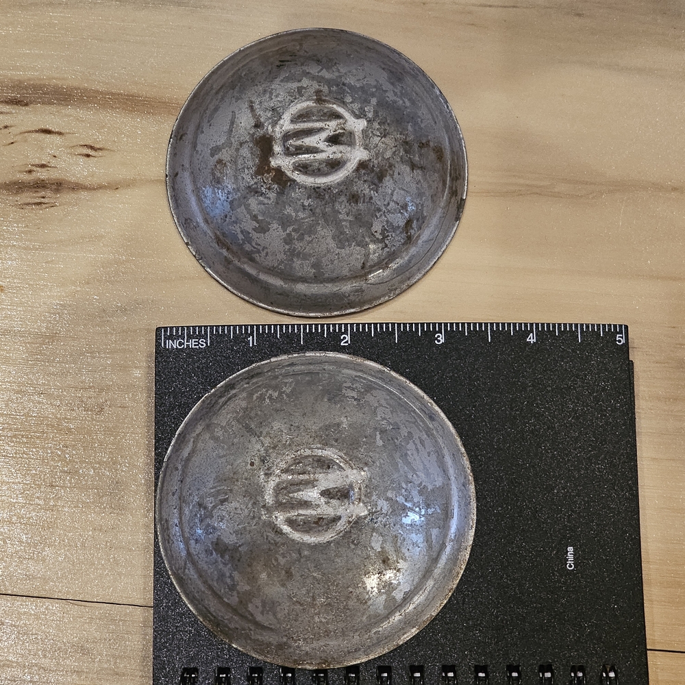 Vintage Metal Hubcaps with Logo